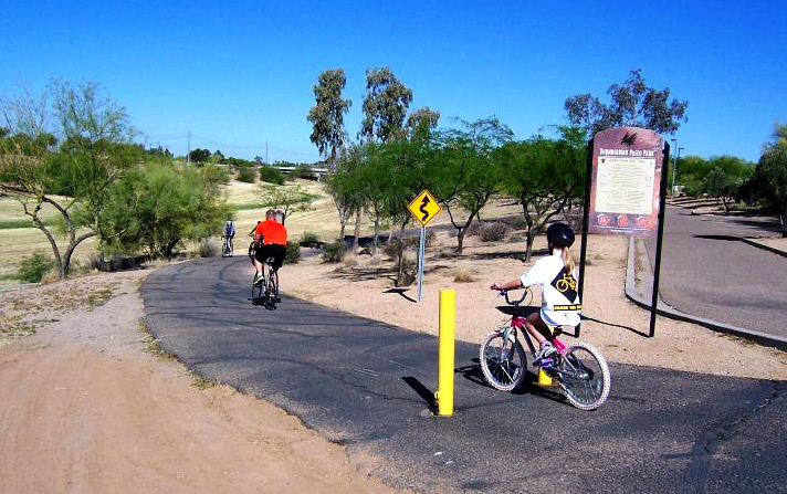 bike-riders-paseo-pathway